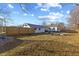 A large backyard with a high privacy fence and patio at 6471 Homestead Dr, Indianapolis, IN 46227