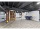 Spacious unfinished basement with painted ceiling and access to stairs at 6471 Homestead Dr, Indianapolis, IN 46227