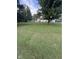 A well-maintained lawn surrounds this home, showcasing its curb appeal and spacious yard at 6471 Homestead Dr, Indianapolis, IN 46227