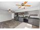 Updated kitchen features gray cabinets, stainless steel appliances and stylish backsplash at 6471 Homestead Dr, Indianapolis, IN 46227