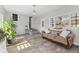 Living room features wood floors, neutral walls, and access to front entry at 6471 Homestead Dr, Indianapolis, IN 46227