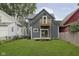 Charming home with a deck and grassy backyard at 730 Sanders St, Indianapolis, IN 46203