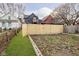 Backyard with raised garden beds and wooden fence at 730 Sanders St, Indianapolis, IN 46203