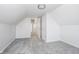 Bright bedroom with grey carpet and access to the hallway at 730 Sanders St, Indianapolis, IN 46203