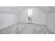 Cozy bedroom with grey carpet and private balcony access at 730 Sanders St, Indianapolis, IN 46203