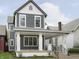 Two-story gray house with white trim and a front porch at 730 Sanders St, Indianapolis, IN 46203