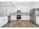 Modern kitchen with stainless steel appliances and white cabinets at 730 Sanders St, Indianapolis, IN 46203