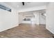 Open living room with hardwood floors and view into kitchen at 730 Sanders St, Indianapolis, IN 46203