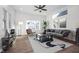 Spacious living room with hardwood floors and large windows at 730 Sanders St, Indianapolis, IN 46203