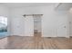 Hardwood floor living room with sliding barn door to laundry at 730 Sanders St, Indianapolis, IN 46203