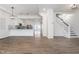 Open concept living room with hardwood floors and kitchen views at 730 Sanders St, Indianapolis, IN 46203