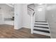 Modern staircase with white railings and dark wood steps at 730 Sanders St, Indianapolis, IN 46203