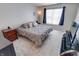 Spacious bedroom with king-size bed and large window at 7665 Sergi Canyon Dr, Indianapolis, IN 46217