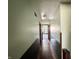 Long hallway with dark wainscoting and wood floors at 78 N Belleview Pl, Indianapolis, IN 46222