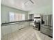 Kitchen with white cabinets, stainless steel appliances, and a bay window at 78 N Belleview Pl, Indianapolis, IN 46222