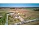 Expansive aerial view of a secluded home on a sprawling country lot with mature trees and farmland at 8116 E 900 N, Wilkinson, IN 46186