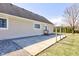 Spacious backyard patio with landscaping and mature trees on the perimeter at 8116 E 900 N, Wilkinson, IN 46186