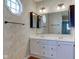 Elegant bathroom featuring double sinks and decorative wallpaper at 8116 E 900 N, Wilkinson, IN 46186