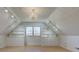 Finished bonus room with built-in shelves and a chandelier at 8116 E 900 N, Wilkinson, IN 46186