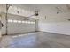 Clean, empty garage with white door and cement floor at 8116 E 900 N, Wilkinson, IN 46186