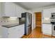 Well-appointed kitchen with stainless steel refrigerator, granite countertops, and ample cabinet space and pantry at 8116 E 900 N, Wilkinson, IN 46186