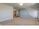 Open living room with staircase and views to the front door and hardwood floors at 8116 E 900 N, Wilkinson, IN 46186