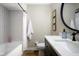 Clean bathroom with subway tile, white vanity, and a new bathtub at 8325 Anemone Ln, Indianapolis, IN 46219