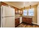 Efficient kitchen featuring ample wood cabinetry and a full appliance set at 123 S Bancroft St, Indianapolis, IN 46201