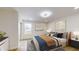 Cozy bedroom featuring a comfortable bed, stylish decor, and ample natural light at 1306 E Minnesota St, Indianapolis, IN 46203