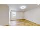 Well-lit bedroom with hardwood floors and closet at 1306 E Minnesota St, Indianapolis, IN 46203