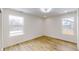 Bright bedroom with hardwood floors and two windows at 1306 E Minnesota St, Indianapolis, IN 46203