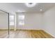 Bright bedroom with mirrored closet doors and hardwood floors at 1306 E Minnesota St, Indianapolis, IN 46203
