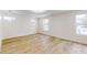 Spacious bedroom with hardwood floors and large windows at 1306 E Minnesota St, Indianapolis, IN 46203
