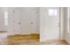 Bright entryway with hardwood floors and coat closets at 1306 E Minnesota St, Indianapolis, IN 46203