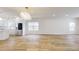 Open concept kitchen and dining area with stainless steel appliances and light wood floors at 1306 E Minnesota St, Indianapolis, IN 46203