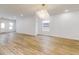 Living room with hardwood floors and chandelier, open concept at 1306 E Minnesota St, Indianapolis, IN 46203