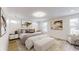 Spacious main bedroom with plush bedding, large windows, and light neutral decor at 1306 E Minnesota St, Indianapolis, IN 46203