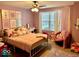 Charming bedroom with pink bedding, a desk, and plenty of storage at 15998 Bugle Ridge Dr, Noblesville, IN 46060