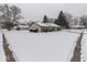 Brick ranch home with attached garage, snow-covered yard at 1611 Vineyard Ct, Indianapolis, IN 46260