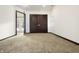 Spacious bedroom with double doors and carpeted floor at 1628 Beulah Ave, Indianapolis, IN 46241