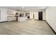 Modern kitchen with island, stainless steel appliances, and laminate flooring at 1628 Beulah Ave, Indianapolis, IN 46241