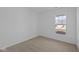Minimalist bedroom with neutral carpeting and window at 16673 Cattle Hollow Ln, Noblesville, IN 46060