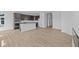 Open-concept kitchen boasts a center island, modern appliances, and flows seamlessly into the living area at 16673 Cattle Hollow Ln, Noblesville, IN 46060