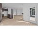 Open concept layout showcasing a kitchen island, spacious living area with fireplace, and ample natural light at 16673 Cattle Hollow Ln, Noblesville, IN 46060