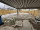 Large backyard with wooden fence and covered patio at 1801 W Morris St, Indianapolis, IN 46221