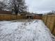 Large backyard with wooden fence and light snow cover at 1801 W Morris St, Indianapolis, IN 46221