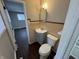 Updated bathroom with gray vanity and beige tile at 1801 W Morris St, Indianapolis, IN 46221