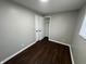 Spacious bedroom with dark brown laminate flooring and a large closet at 1801 W Morris St, Indianapolis, IN 46221