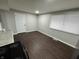 Simple dining area with dark brown vinyl flooring at 1801 W Morris St, Indianapolis, IN 46221