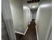 Bright hallway with dark brown flooring and access to other rooms at 1801 W Morris St, Indianapolis, IN 46221